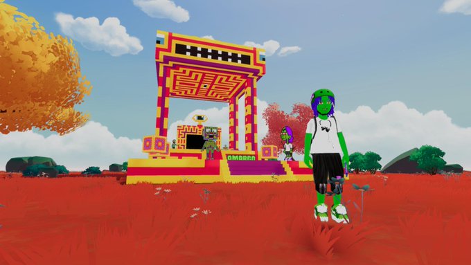 Screenshot from a colorful video game showing a green-skinned character in a white shirt standing in a red field in front of a vibrant, blocky temple-like structure with 'AMBASS' written on it.