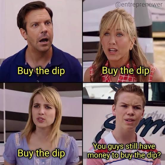 The image features four people, two men and two women, with each person wearing a different colored shirt - blue, red, pink, and white. They are all looking at something or someone off-camera, possibly engaged in a conversation or observing an event. The caption of the image reads "You guys still have money to buy the dip?". This could be interpreted as a humorous statement about the current state of the economy or a reference to a popular meme.