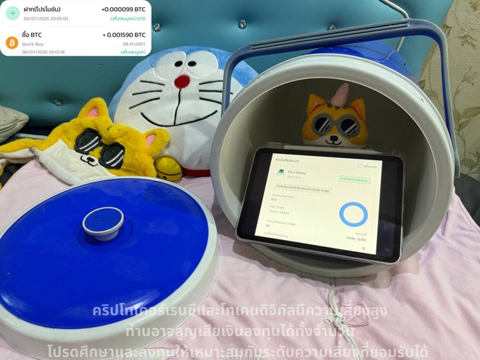 A lifestyle photo showing a smartphone inside a pet house displaying the TONX wallet app, alongside cartoon cat plushies, with overlay text promoting daily crypto earnings in Thai and transaction popups for BTC purchases.