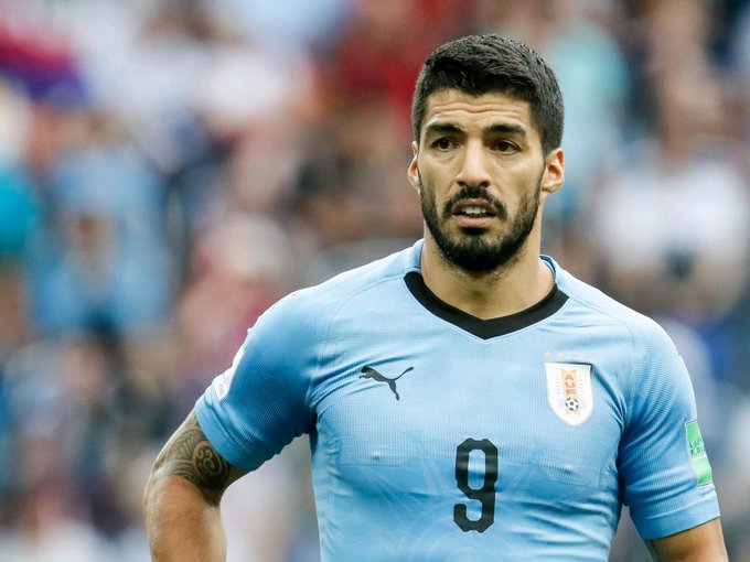 Uruguayan soccer player Luis Suárez wearing the light blue number 9 Uruguay national team jersey with a Puma logo, photographed during a match.