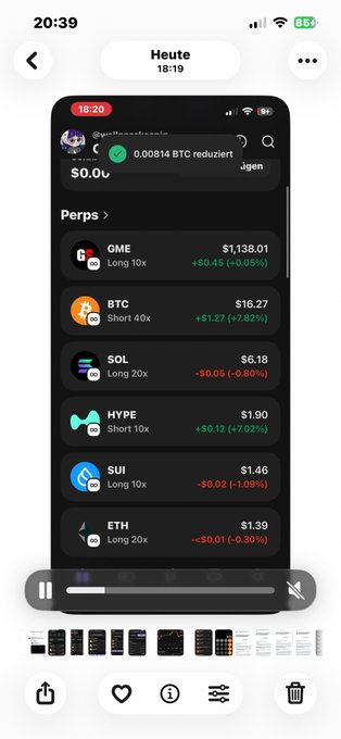 The image shows a cell phone screen displaying a list of cryptocurrency trading options, including Bitcoin, Etherium, and others. The user interface has a black background with white text, making it easy for users to navigate through the available options. The post on social media encourages users to invest in these cryptocurrencies by highlighting their potential gains or losses.
