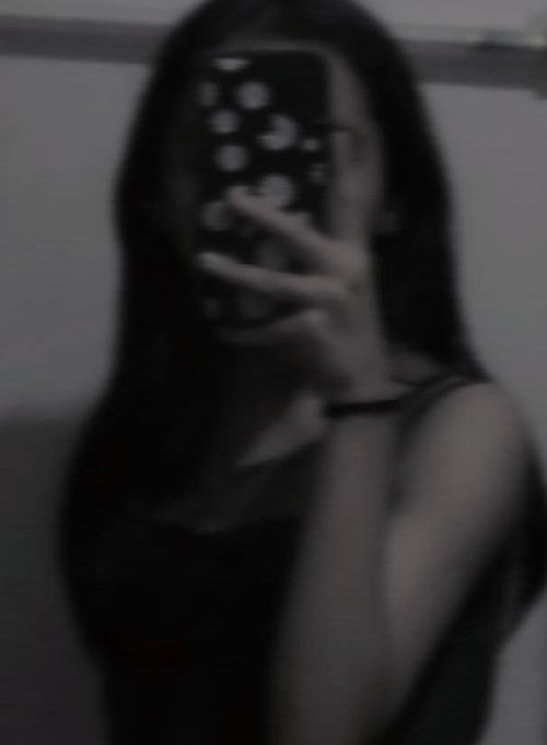 A grainy black-and-white mirror selfie shows a person with long dark hair holding up a phone with a dotted case, obscuring their face as they pose in a dimly lit room. The intimate, anonymous vibe of the late-night selfie matches the post's casual "good night web3" sign-off, framing it as a cozy send-off to online followers.