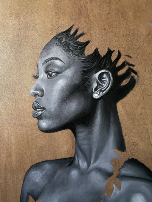 urn of gold and brown hues, with a black and white portrait of a woman's face and shoulders.