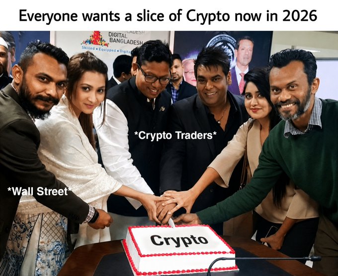 The image features a group of people gathered around a table with a large cake placed at the center. The cake has "Crypto" written on it, indicating that they are celebrating or discussing cryptocurrency. The text in the image suggests that everyone wants a slice of Crypto now in 2021, which could be interpreted as an attempt to make a statement about the increasing popularity and importance of cryptocurrencies in today's world.

The post also mentions Wall Street, which might indicate that this gathering is taking place at a financial institution or event related to cryptocurrency. The image captures a moment where people are coming together to celebrate or discuss the future of crypto, with everyone eagerly waiting for their share of the cake.