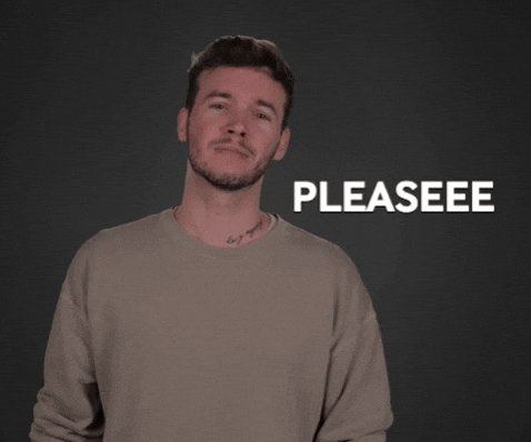 The image features a man standing against a black background. The man has a beard, a tattoo, and his shirt is white with a gray sweater underneath. He looks up at the camera while wearing his jacket sleeves rolled up. In front of him is text that reads "Please see me".