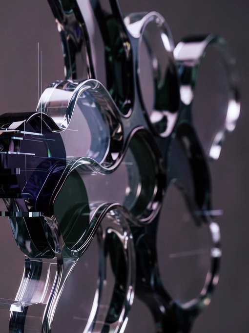 A close-up, futuristic 3D rendering of a glossy, metallic silver structure featuring interconnected circular openings and a wavy, undulating surface.