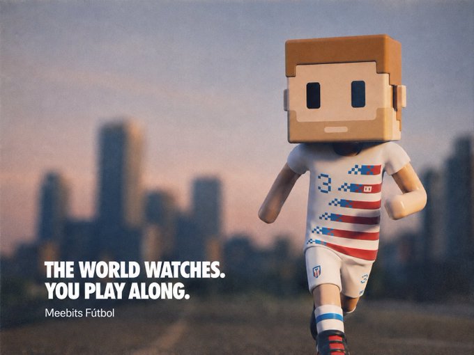 The image features a small, cardboard cutout of a soccer player dressed in an American flag jersey with white shorts and black cleats. The player appears to be running or jogging across the frame. In the background, there are buildings visible, suggesting that this scene takes place in an urban setting. The caption below the image reads: "The World watches you play along."