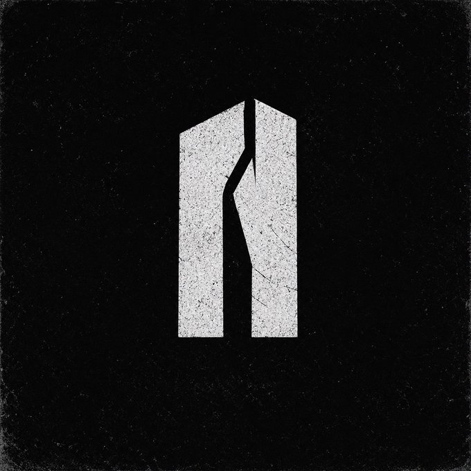 Black and white distressed graphic featuring a stylized geometric shape resembling a broken or split monolith on a dark textured background.