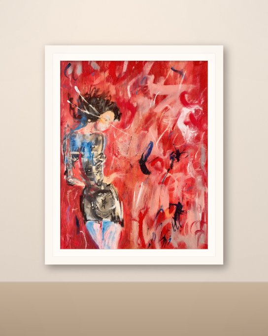 A framed abstract expressionist painting with dominant red hues depicting a figure, displayed against a beige wall.