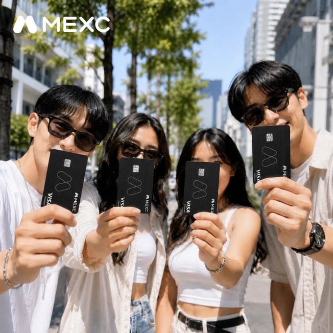 Four young people in white outfits and sunglasses hold up black MEXC Visa credit cards on a city street, with the MEXC logo in the top left corner.