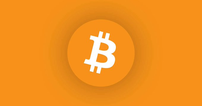 A white Bitcoin "₿" symbol centered inside an orange circle on an orange background, representing the Bitcoin logo. The image visually reinforces the post's question about long-term Bitcoin holders (Bitcoiners) potentially selling their decade-old BTC on January 1, 2028, when coins from 2018 will become spendable.