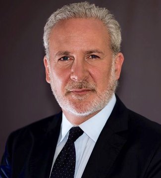 The image features a man wearing a suit, tie, and white shirt with grey hair. He has a serious expression as he looks directly at the camera. The background of the photo appears to be black, which contrasts with the man's attire. There is also text in the image that reads "Anti-Bitcoin Peter Schiff admits Bitcoin is digital gold." This statement seems to be related to the man's profession or beliefs about Bitcoin.
