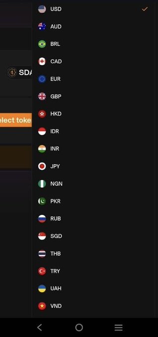 A dropdown menu displays Sidra Chain's expanded fiat currency support for SDA swaps, featuring flags and ticker codes for USD, AUD, BRL, CAD, EUR, GBP, HKD, IDR, INR, JPY, NGN, PKR, RUB, SGD, THB, TRY, UAH, and VND—with USD currently selected (checkmarked). This visual confirms the post's announcement of Sidra Chain's latest update enabling multi-currency swap functionality.