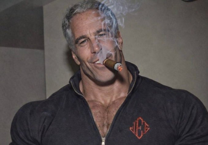 A muscular older man with gray hair smokes a lit cigar while wearing a black zip-up jacket featuring a red "JC" monogram logo, his confident pose in contrast to the accompanying "sidelined?" caption suggesting he appears far from out of the game.