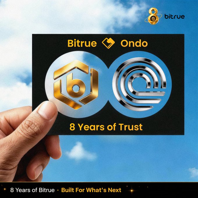A hand holds up a black card against a bright blue sky, featuring the "Bitrue" and "Ondo" logos with a handshake icon, alongside gold and silver interlocking circular emblems and the tagline "8 Years of Trust." The Bitrue logo with an "8" anniversary mark appears in the top right, while the bottom banner reads "8 Years of Bitrue · Built For What's Next," celebrating Bitrue's milestone while highlighting its expanded support for Ondo's tokenized RWA ecosystem with spot and ETF markets.