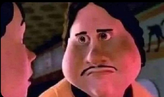 The image shows a close-up of a Pixar-style animated character with wide, shocked eyes and a disappointed, pouty expression, set against a dimly reddish background with another character partially visible on the left. The meme captures the IT guy's exasperated reaction to the user pressing the power button instead of any other key to continue, highlighting the relatable frustration of technical mishaps.