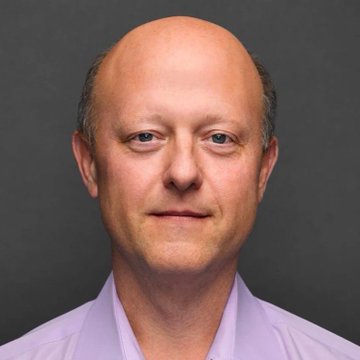 A headshot of a balding man in a light lavender shirt appears alongside news that Circle ($CRCL) has expanded its partnership with BNY Mellon, making USDC the first stablecoin on BNY's Digital Asset Custody platform.