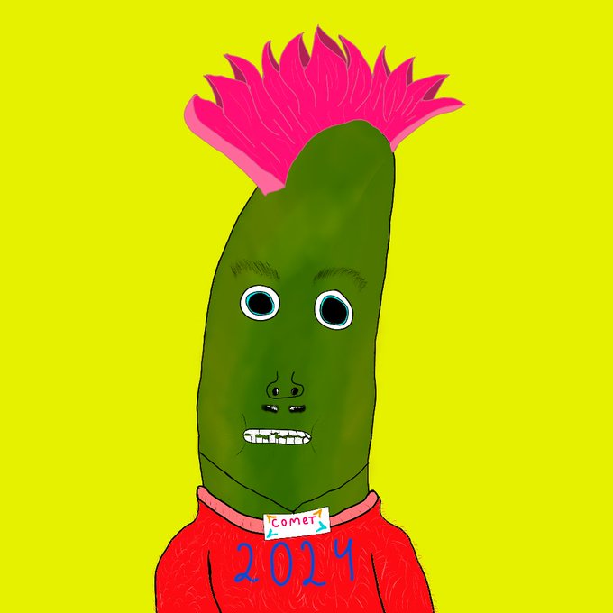 A cartoon illustration on a yellow background featuring a green pickle-like character with a pink flame-shaped mohawk, wearing a red shirt with 'COMET' and '2024' written on it.