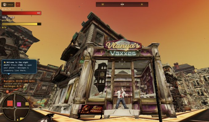 The image shows a man standing outside of an old, run-down building with a sign that reads "Vanishas' Vaxxers". The man appears to be looking at something or someone inside the building. The surrounding area includes other buildings in the background and a street scene.