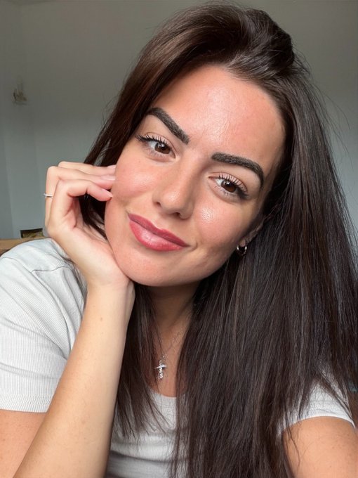 A confident, well-groomed woman with long brunette hair smiles softly at the camera, her chin resting gently on her hand while wearing a delicate cross necklace and a simple white top.

The image conveys professional warmth and approachability, aligning with the post's introduction of a polished 30-year-old Business Operations leader seeking her next role and open to connecting with founders and teams in Web3.