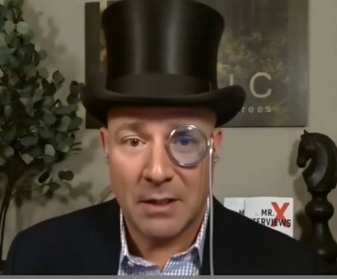 A man wearing a black top hat and a monocle appears in a video setting, with a "MR. X INTERVIEWS" sign visible in the background, reinforcing the post's tongue-in-cheek financial advice to sell Bitcoin at $90K and buy back at $81K after paying capital gains taxes. The formal, aristocratic styling of his outfit adds a satirical flair to the counterintuitive trading strategy being promoted.