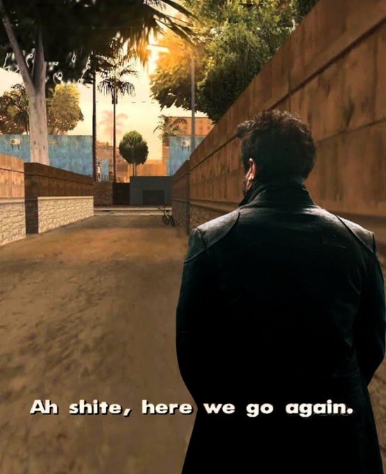 A meme-style screenshot of a video game showing a male character in a black leather jacket standing in a street, with the subtitle 'Ah shite, here we go again.'