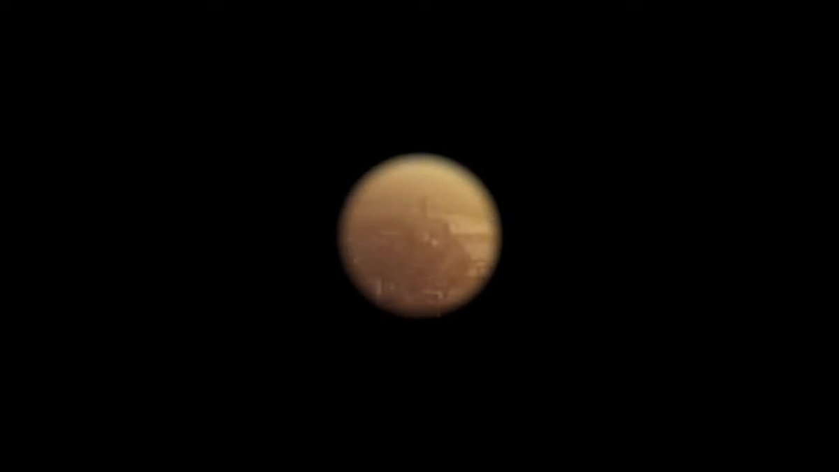 The image shows a close-up view of a planet, possibly Mars or Venus, with a black background that highlights its features. The caption below the image reads "Efff it we all going down this rabbit hole together $Xpr youtu.be/OtTAmdS033o?". This phrase is likely a reference to the popular internet meme about people spending hours on end exploring various rabbit holes and sharing their experiences online, with the caption being one of those shared experiences.