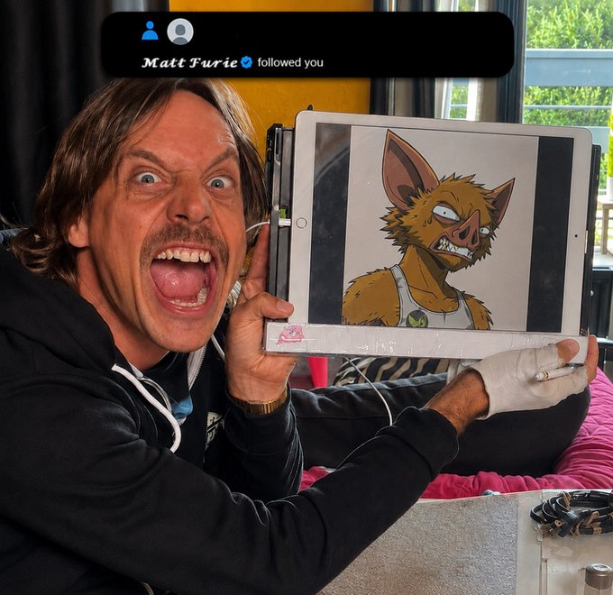 A man with an exaggerated open-mouthed expression holds up a tablet displaying an illustration of an angry-looking cartoon rat character, while a notification banner at the top reads "Matt Furie ✓ followed you." The image captures the moment referenced in the post—a follow notification from Matt Furie (creator of Pepe) coinciding with a display of a rat-themed artwork, tying into the user's bullish sentiment about the $HOODRAT community and conviction in holding.