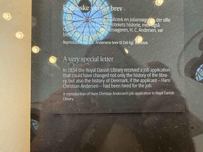 An informational placard titled "A very special letter" describes a reproduction of H. C. Andersen's 1834 job application to the Royal Danish Library, displayed behind glass.