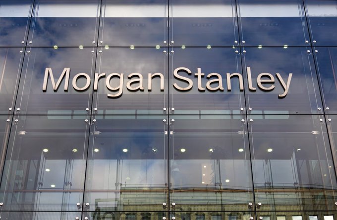 A glass-fronted building displays the 'Morgan Stanley' signage in white letters against a reflective facade.
