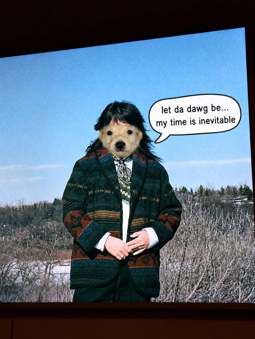 A humorous edit of a person wearing a patterned green jacket with a dog's head, with a speech bubble reading 'let da dawg be... my time is inevitable'.