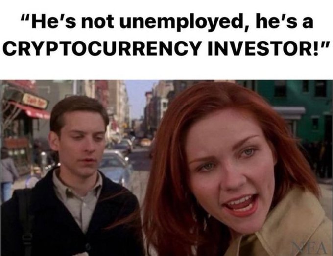 The meme features a scene from Spider-Man with Mary Jane defending Peter Parker, with text reading "He's not unemployed, he's a CRYPTOCURRENCY INVESTOR!" It humorously reframes unemployment as a respectable crypto career, with the "tell them babe" caption suggesting MJ is convincing others on his behalf.