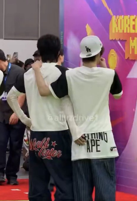 Two young men in BAPE and 'World Center' apparel pose together at what appears to be the Korea event.