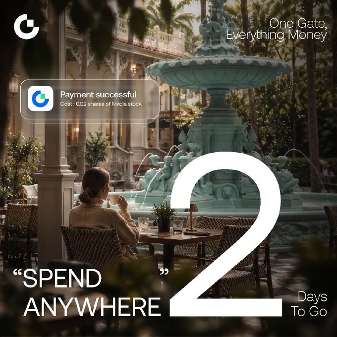 A woman sits at an outdoor café beside an ornate fountain, with an overlay showing a "Payment successful - 0.002 shares of Nvidia stock" notification, promoting a 2-day countdown to the "SPEND ANYWHERE" feature launch with the tagline "One Gate, Everything Money."