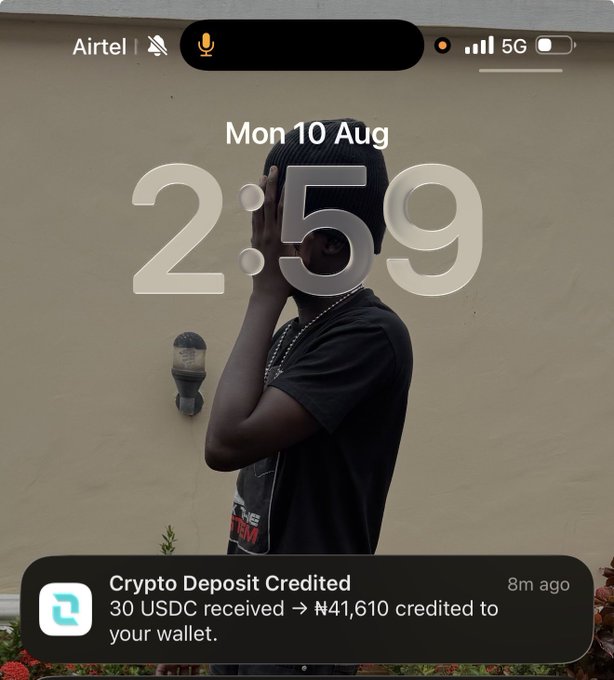 The image shows an iPhone lock screen dated Monday, August 10, displaying a time of 2:59, with a notification from a wallet app confirming "Crypto Deposit Credited — 30 USDC received → ₦41,610 credited to your wallet." This aligns with the caption highlighting the successful crypto-to-naira conversion feature, teasing an upcoming naira-to-dollar option.