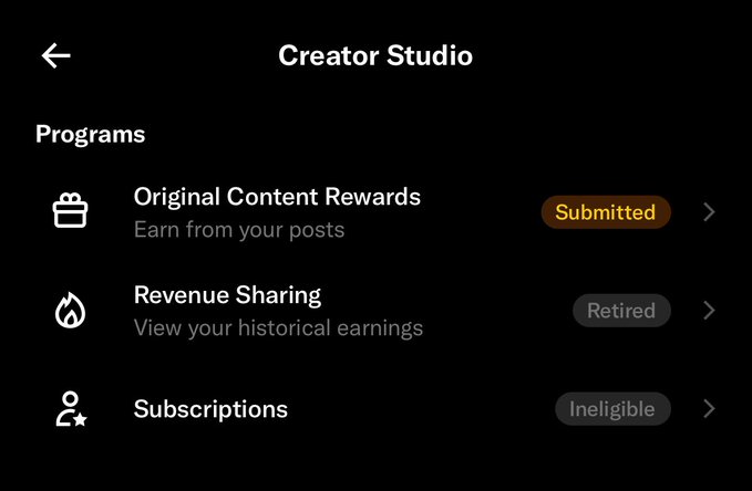 The image shows the Creator Studio page on X with the status of an Original Content Rewards application marked as "Submitted" alongside retired Revenue Sharing and ineligible Subscriptions programs. This visually confirms the user's announcement about applying for the OG rewards program, while the gray status badges for the other programs suggest their account history and current standing on the platform.
