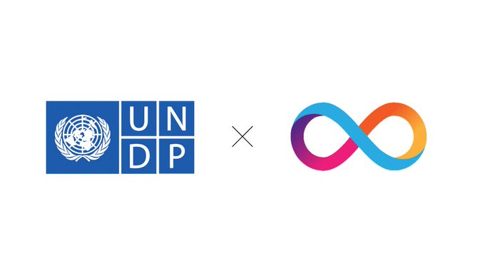 The image displays the UNDP (United Nations Development Programme) logo alongside DFINITY's infinity symbol, connected by an "X" symbol to indicate their collaboration, visually representing the partnership announced in the post.