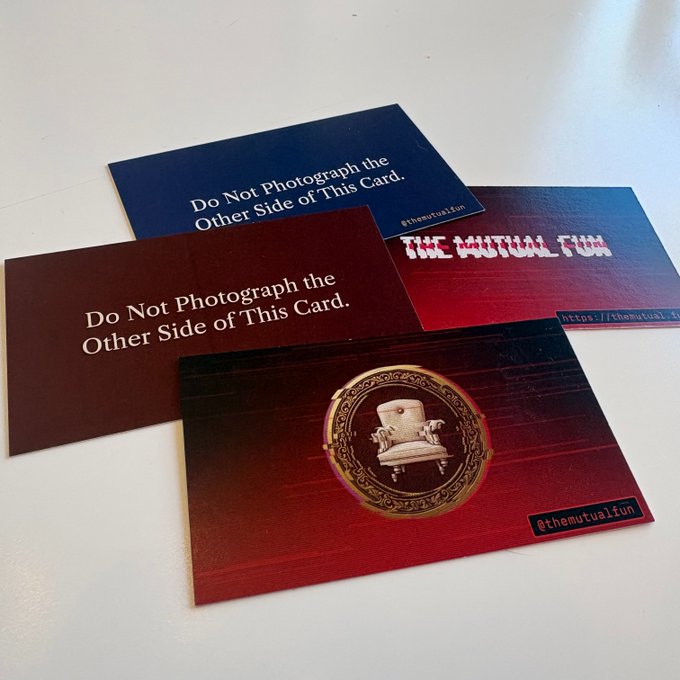 A collection of promotional cards for 'THE MUTUAL FUN', with two cards showing 'Do Not Photograph the Other Side of This Card' and a third showing an ornate chair emblem.