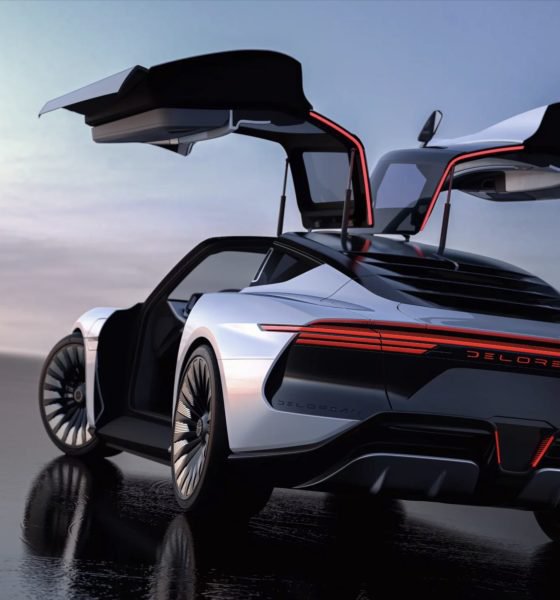 A silver DeLorean sports car is shown with its gull-wing doors open, featuring red accent lighting along the rear and the 'DELOREAN' nameplate.