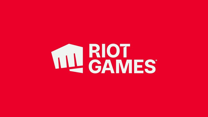 The image features a red background with white text that reads "Riot Games". Below the main text, there's an image of a fist symbolizing strength or power. The caption below the image reads "Stick it on @Ronin_Network Kind regards, Eleni".