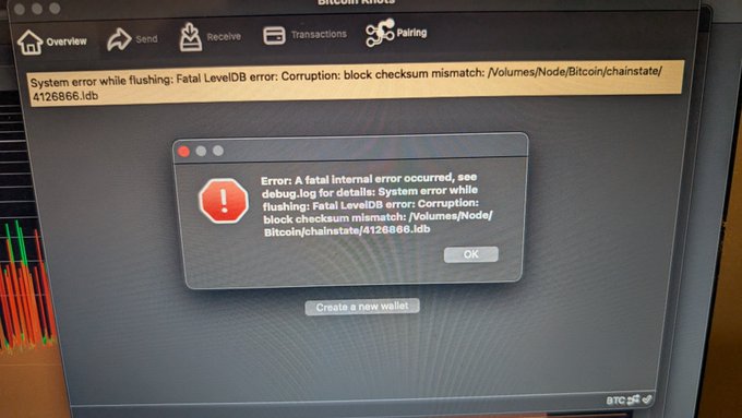 A Bitcoin Knots wallet application displays a fatal system error: "Corruption: block checksum mismatch: /Volumes/Node/Bitcoin/chainstate/4126866.idb," prompting the user to attempt a fix by running reindex-chainstate=1.