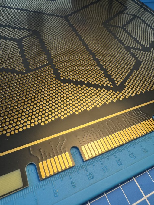 A close-up view shows the edge of a black and gold halftone-printed Bitcoin logo sticker with exposed copper contact pads, resting on a blue cutting mat marked with ruler measurements from 7 to 15. The image ties to the post as a creative recovery project, transforming a disappointing Coldcard experience into Bitcoin-themed artwork while healing from feelings of depression.