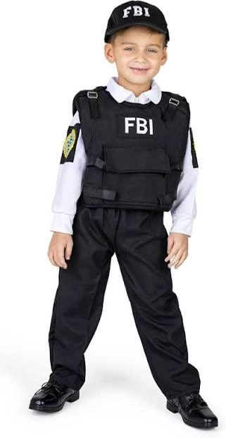 A smiling young boy wears an "FBI" cap and tactical vest over a white dress shirt and black pants. The image satirizes the poster's complaint about fans threatening investigations by visually embodying the "10-year-old playing detective" they mock.
