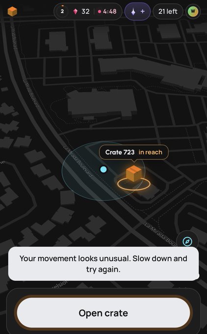 A map interface from an app showing a crate labeled 'Crate 723 in reach' with a warning message that reads 'Your movement looks unusual. Slow down and try again.'