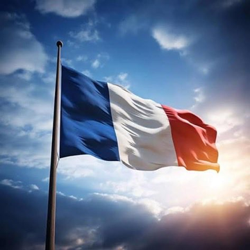 The French tricolor flag waves against a partly cloudy sky at sunset, symbolizing the nation's latest legislative move. The flag visually represents France as it pushes forward with proposed exit taxes targeting crypto holders and imminent taxation on crypto-to-stablecoin swaps.