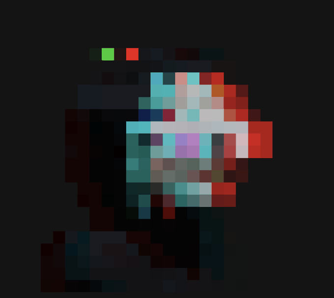 A highly pixelated image on a dark background showing blocks of teal, red, white, and purple colors.