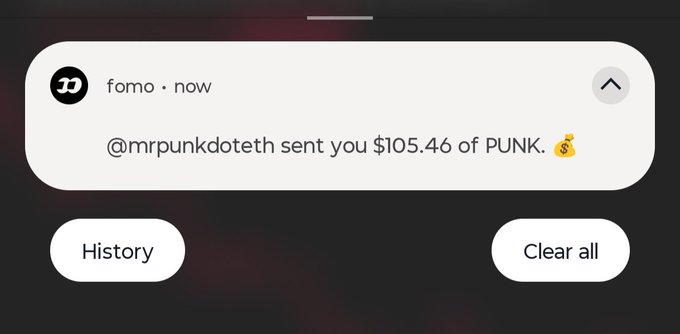 A mobile notification from the app 'fomo' stating '@mrpunkdoteth sent you $105.46 of PUNK.' with History and Clear all buttons below.