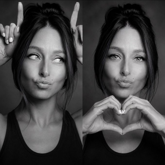 A black-and-white side-by-side portrait of a young woman with her hair in a top knot; on the left she makes a funny face with her fingers as 'horns' on her head, and on the right she makes a heart shape with her hands in front of her face.