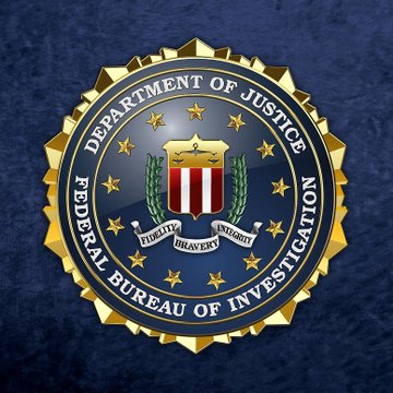 The image displays the official seal of the Department of Justice Federal Bureau of Investigation (FBI), featuring a central shield with red and white stripes, surrounded by gold stars and laurel wreaths on a dark blue background, which directly relates to the post about the arrested FBI supervisory counterintelligence agent who allegedly stole seized cryptocurrency from a criminal investigation.