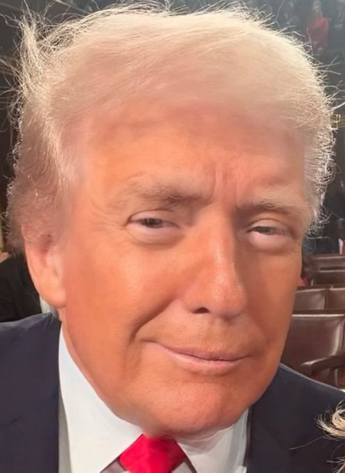 A close-up shows Donald Trump in a suit and bright red tie, appearing to make a skeptical expression. The post’s “hold” message appears aimed at mocking or challenging those who lack conviction, reinforced by Trump’s stern look.